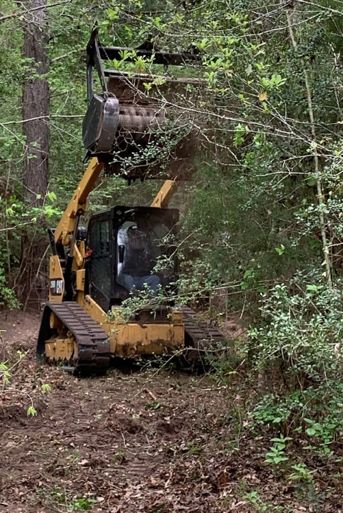 Land clearing with heavy equipment