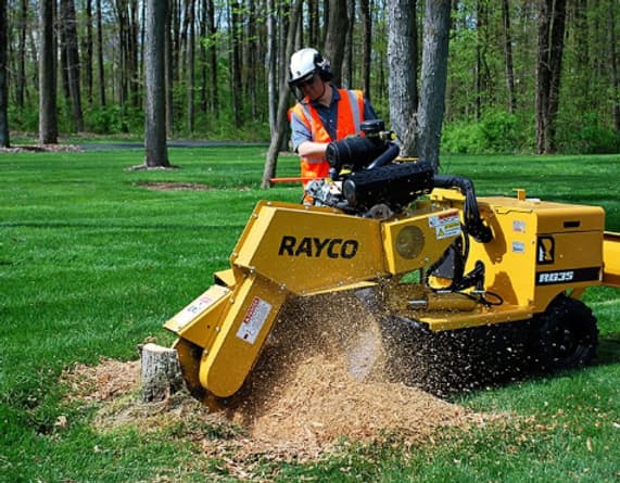 Close-up of commercial stump grinding equipment used by JRC Outdoor Services in Oakland County